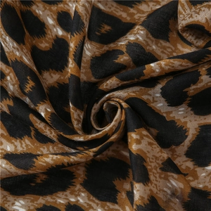 Macro shot of thick leopard print scarf showing soft texture and fine fabric weave