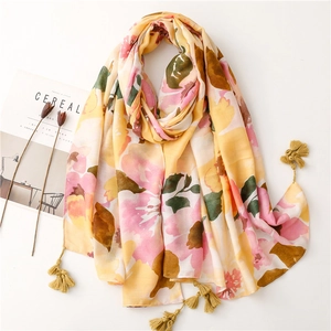Floral cotton linen scarf with yellow tassels and soft color gradient for beach vacation
