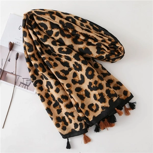 Close-up of leopard print scarf with soft cotton-linen texture and dual-tone tassels