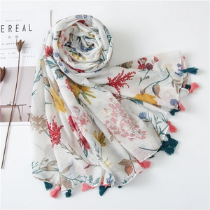 Floral cotton linen shawl with tassels for sun protection and summer travel styling
