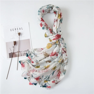 Floral print cotton linen shawl with colorful tassels and soft semi-transparent fabric