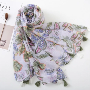 Lavender cotton linen scarf with green leaf prints and dual-color tassels on white background