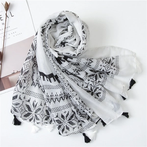 Lightweight white scarf with black geometric patterns and fringes, minimalist cotton linen