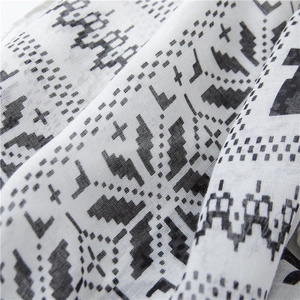 Detailed view of lightweight cotton linen scarf with black geometric ethnic patterns