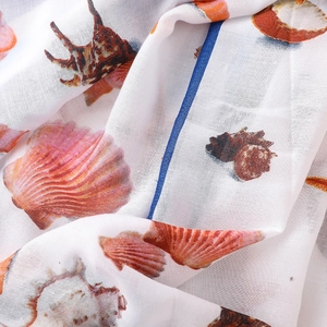 Lightweight linen cotton scarf with seashell prints and elegant blue border accent