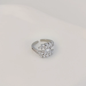 Detailed macro view of adjustable leaf ring with marquise and round cubic zirconia stones