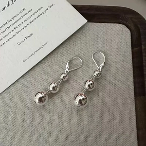 Minimalist silver triple metal ball drop earrings with polished mirror finish for women