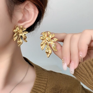 Statement gold flower earrings with irregular liquid metal texture for women