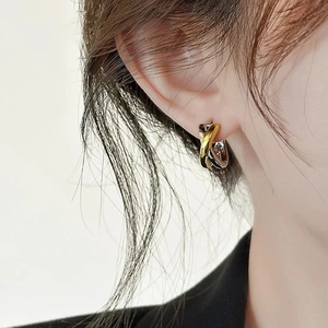Minimalist three-tone intertwined hoop earrings with gold, silver and black finish
