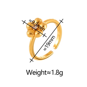 Minimalist adjustable gold flower ring featuring a sparkling central cubic zirconia stone