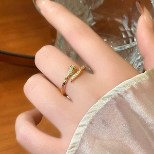 Elegant gold snake open ring with cubic zirconia detailing and adjustable coiled design