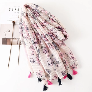 Pink and white striped scarf with floral and butterfly patterns and fringed edges