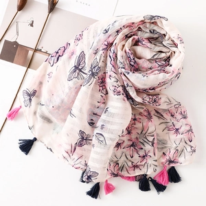 Floral butterfly print cotton linen scarf with pink tassels on creamy white fabric