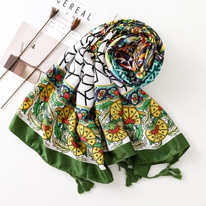 Floral cotton linen scarf in green, yellow and white with tassels for summer travel