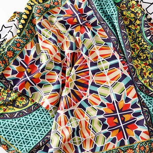 Macro shot of colorful geometric and ethnic patterns on cotton linen summer scarf