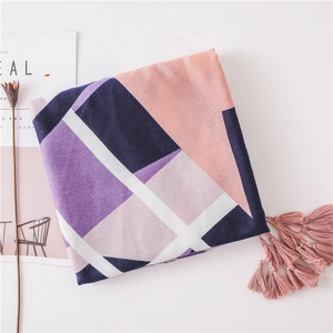 Close-up of geometric color block cotton linen scarf with pink fringe tassels