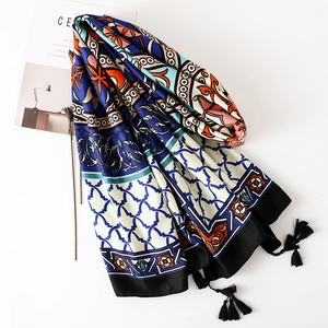 Detailed view of Thai ethnic cotton linen shawl with totem prints and black tassels