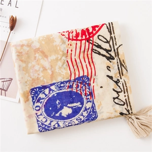 Detail of vintage postmark print and soft fringe edges on long cotton linen scarf