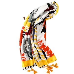 Châle vibrant en coton et lin pour femmes avec imprimé graffiti jaune et pompons