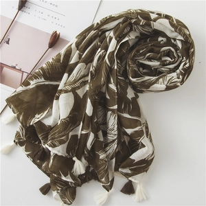 Brown and white banana leaf pattern long shawl with tassel edge on white background