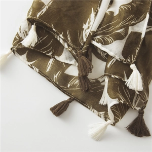 Detail of banana leaf print on lightweight cotton-linen scarf with fringed edges