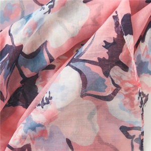 Detail of pink floral print on lightweight translucent cotton linen scarf fabric