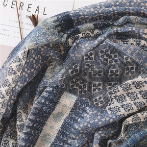 Close-up of vintage blue geometric pattern and texture on soft cotton linen scarf