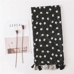 Lightweight black summer beach scarf with white unicorn patterns and tassel trim edges
