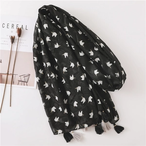 Lightweight black beach scarf with white unicorn prints and decorative tassels
