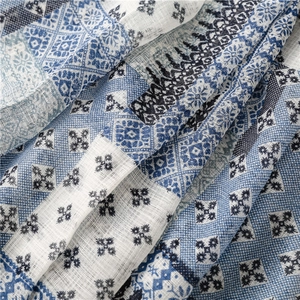 Detail showing the blue and white ethnic geometric print and linen fabric texture