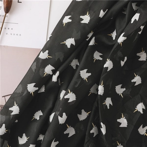 Lightweight black beach scarf with white unicorn patterns and gold details for summer