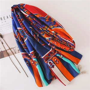 Close-up of bohemian paisley printed scarf featuring delicate tassel fringe details