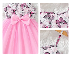 Detail of pink girls' dress featuring butterfly prints and a large waist bow decoration