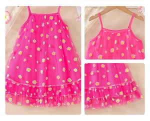 Detailed view of kids daisy mesh dress with ruffled hem and white floral patterns