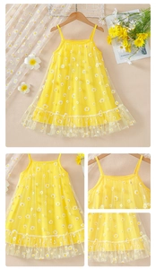 Close-up of yellow girl's daisy tulle dress with detailed white floral embroidery