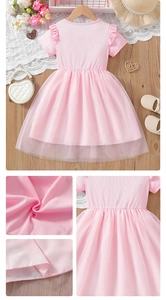 Detail view of pink girl's princess dress showing ribbed texture and layered tulle skirt