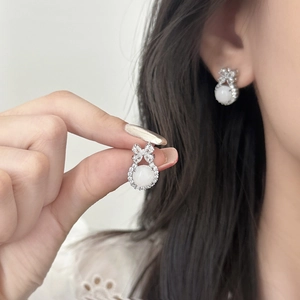 Elegant bowknot resin stud earrings with micro-inlaid cubic zirconia and jade finish