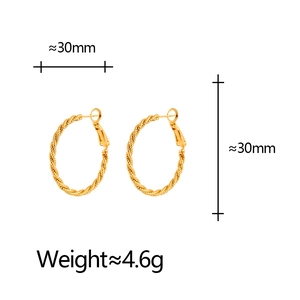 Elegant 30mm golden twisted rope hoop earrings with minimalist high-fashion metallic texture