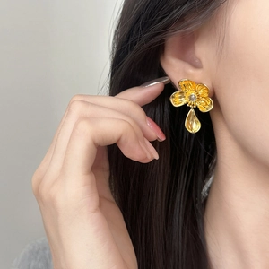 French style gold flower earrings with a teardrop metal pendant and sparkling crystal