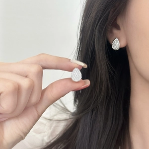 Sparkling teardrop stud earrings with pavé crystals in polished silver setting