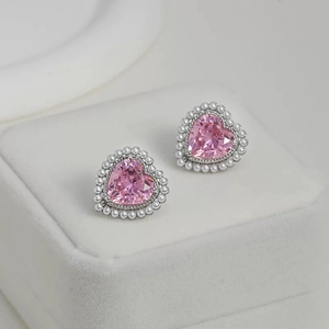 Pink heart zircon earrings with pearl halo on white velvet jewelry box for women