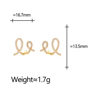 Detail view of gold donut earrings with white zircons showing 16.7mm width and 13.5mm height