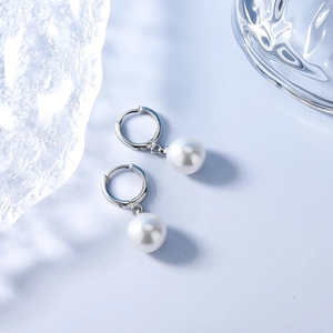 Elegant pearl drop hoop earrings in S925 silver on a minimalist blue background