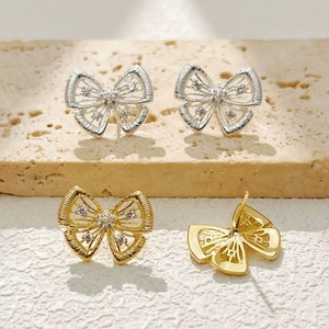 Boucles d'oreilles nœud vintage français avec zircons en tons or et argent