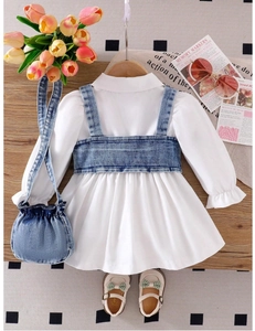 Detail of girl's puff sleeve dress set with denim vest and matching drawstring bag