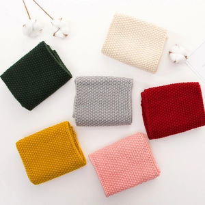 Soft knit baby scarves in six colors including green, beige, and red for warm winter wear