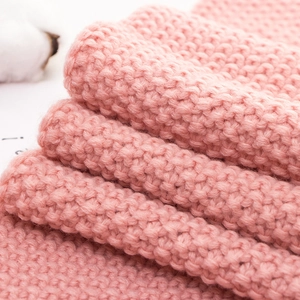 Pink knitted baby scarf for infants with soft garter stitch texture for winter warmth