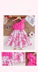 Detail of pink one-shoulder ruffle dress for girls featuring floral tulle and fine stitching