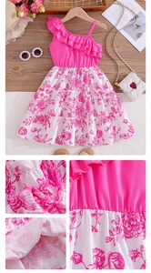 Detail of pink floral print and ruffled one-shoulder strap on white summer dress