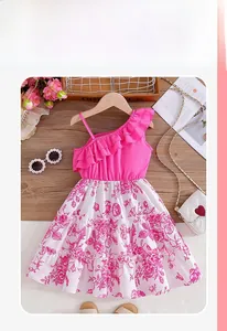 Detail of pink one-shoulder ruffle dress with floral print for girls on wooden hanger